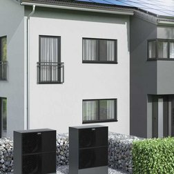 Ein Mehrfamilienhaus mit Wärmepumpen.